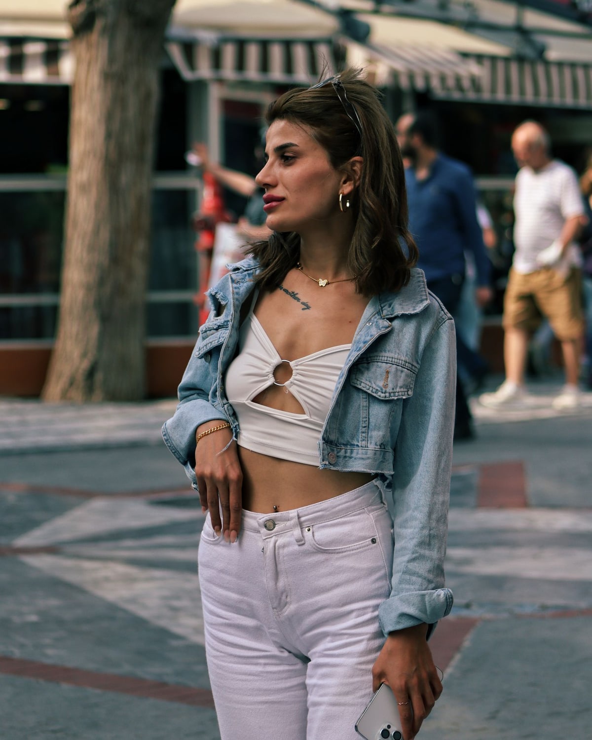 Woman wearing a denim jacket outdoors
